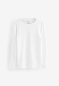 T-shirt bianco a maniche lunghe realizzato in cotone morbido, con scollatura rotonda, cuciture laterali discrete e una texture liscia e non decorata.