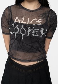 Black sheer mesh top featuring the text "ALICE COOPER" in white dripping font, with a geometric pattern and short sleeves.