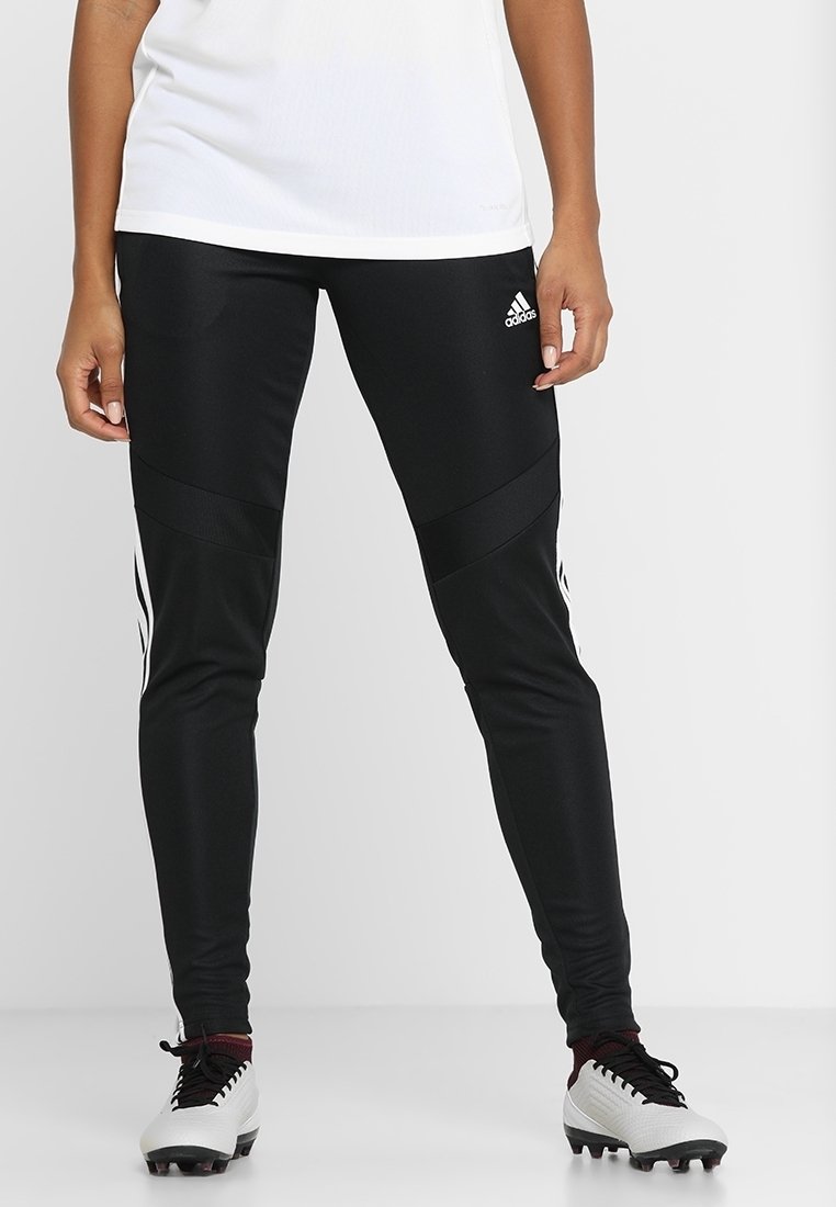 Black athletic leggings with a fitted design, featuring horizontal and vertical seams. White three-stripe accents along the sides, made of stretchable fabric.