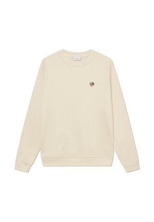 Sweatshirt crème avec manches longues, poignets et ourlet côtelés. Présente une petite broderie florale sur la partie gauche de la poitrine.