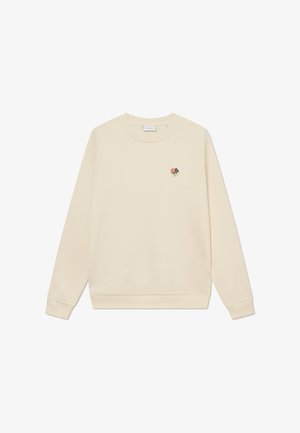 Cream-colored sweatshirt with long sleeves, ribbed cuffs, and hem. Features a small floral embroidery on the left chest area.
