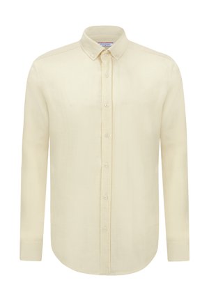 Camisa amarilla clara de botones con cuello estructurado, mangas largas y dobladillo recto. La tela parece suave y ligera con una textura sutil.