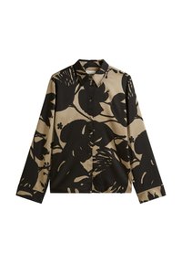 Chemise à manches longues beige avec de grands motifs floraux noirs, dotée d'un col pointu et d'une fermeture à boutons. Texture de tissu douce et lisse.