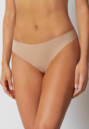 Nude seamless bikini briefs with a smooth, matte finish, featuring a low-rise design and minimal stitching for comfort.