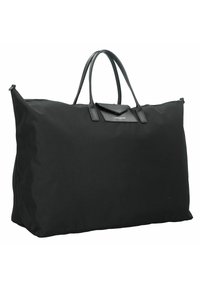 Sac fourre-tout en tissu noir avec des poignées en cuir doubles, forme rectangulaire et un petit patch en cuir portant du texte. Texture extérieure lisse.