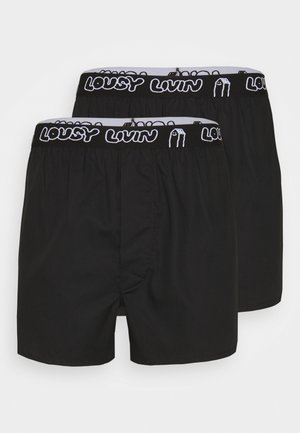 Black boxers featuring an elastic waistband with "LOUSY LIVIN" text and a simple design. Made from soft, lightweight fabric.