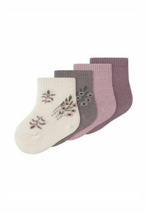 Quatre paires de chaussettes courtes : une crème avec un motif floral, trois dans des tons de gris et de rose avec une texture côtelée.