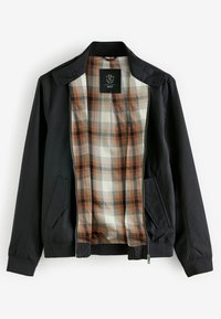 Veste noire zippée avec doublure à carreaux marron et crème, deux poches avant et col montant, posée à plat avec le devant ouvert.
