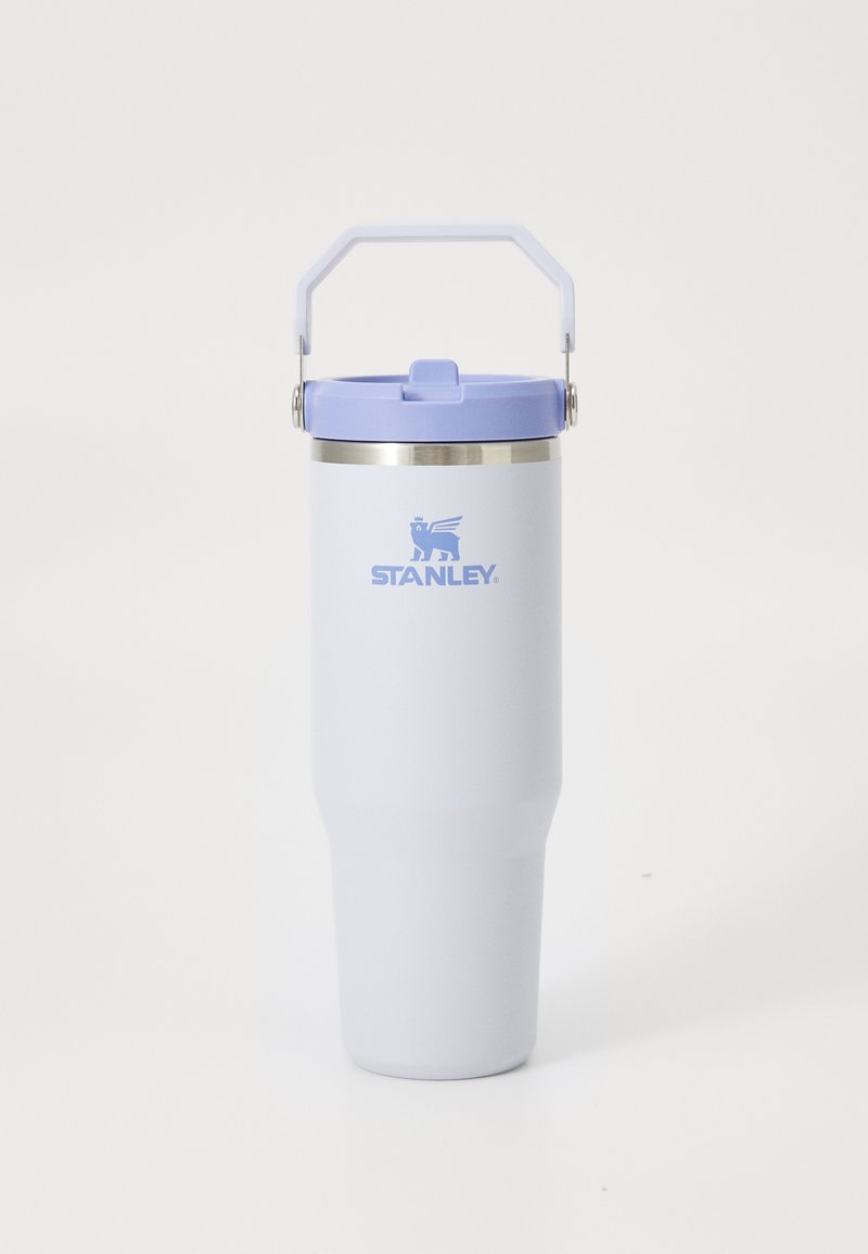 Tall, light purple Stanley travel mug with a handle on the lid and a flip-top drinking spout on a white background.