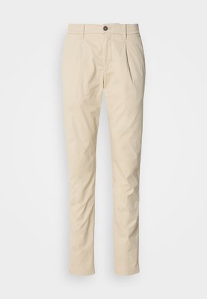 Beige slim-fit men's trousers with belt loops, button closure, and front pleats, laid flat on a white background.