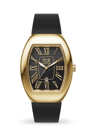 Orologio rettangolare dorato con quadrante nero, numeri romani, display della data e cinturino in silicone nero testurizzato.