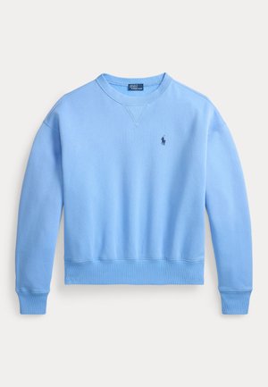 Lys blå crewneck-sweatshirt laget av mykt materiale. Har ribbestrikkede mansjetter og kant, med en liten brodert logo på brystet.