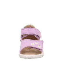 Purple toddler sandal with two adjustable straps, small white flower designs on front strap, and a white sole facing forward.