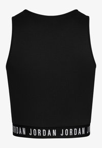 Top sportivo nero corto realizzato in materiale liscio. Presenta un collo tondo e un ampio elastico con la scritta "JORDAN" in bianco.