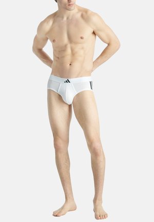 Weiße Boxershorts mit schwarzen Akzenten, ausgestattet mit einem breiten elastischen Bund und einem engen Schnitt. Glatte Textur und minimalistischer Stil.