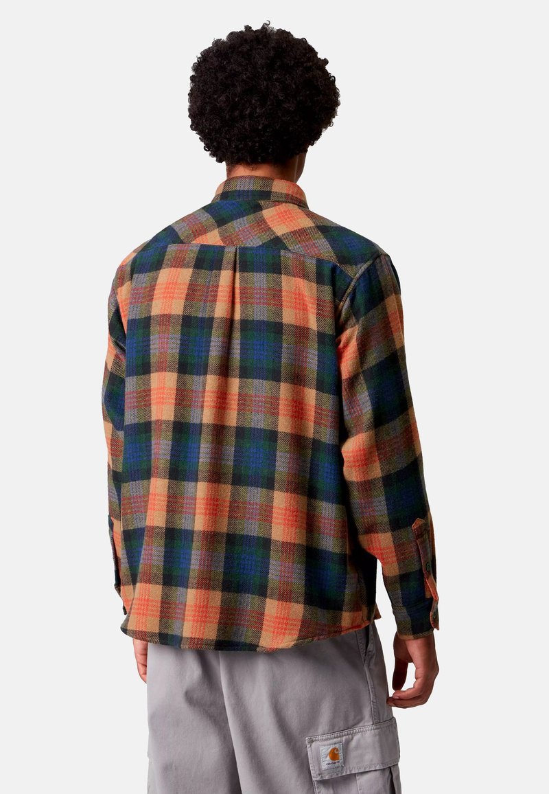 Camicia di flanella a quadri nei colori arancione, verde e blu, con colletto abbottonato, maniche lunghe e orlo spaccato. Tessuto morbido con una vestibilità comoda.