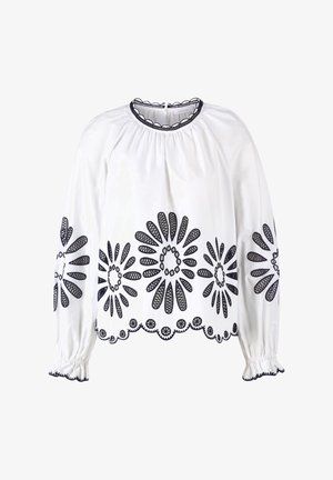 Hvid bluse med marineblå blomsterbroderi, lange ærmer, rynket halsudskæring og elastiske manchetter. Kant har en detaljeret blondekant.