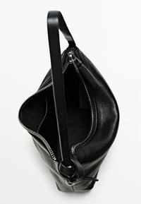Black leather bag with a zip closure, exposing a smooth black interior. Features a textured exterior and a sturdy black handle.