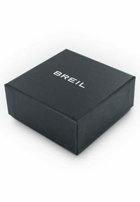 Caja de regalo de cartón negro con textura suave, con la marca blanca "BREIL" en la parte superior, forma cuadrada y bordes limpios.