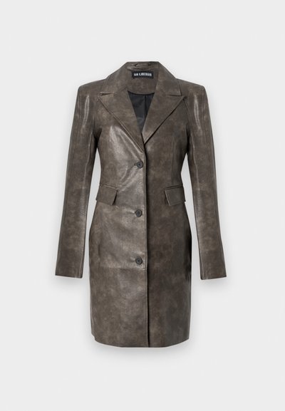 Brown leather jacket with a sharp collar, single-button closure, side pockets, and smooth texture. Tailored fit with long sleeves.