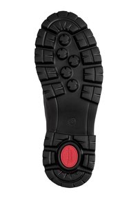 Semelle de botte noire robuste avec des crampons profonds, des motifs d'adhérence ronds et une insertion circulaire rouge de confort près du talon, taille indiquée 37.