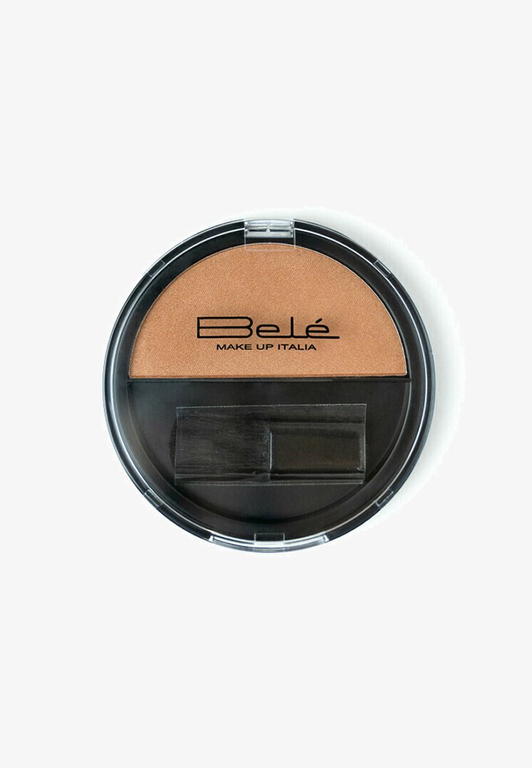 Cialda di bronzer arrotondata con una superficie bronzea lucida, un coperchio di plastica trasparente e un pennello incluso per l'applicazione.