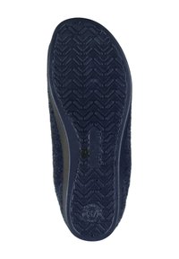 Navy blue slipper with a textured rubber sole, featuring a patterned tread for grip. The upper is made of soft, fuzzy material.