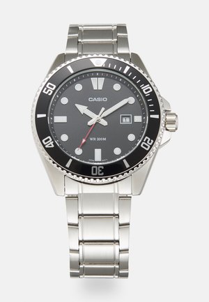 Stainless steel watch with a black dial, luminous markers, and a date window. Features a rotating bezel and a silver metal bracelet.