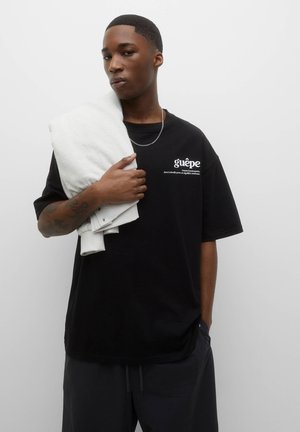 T-shirt med print - black
