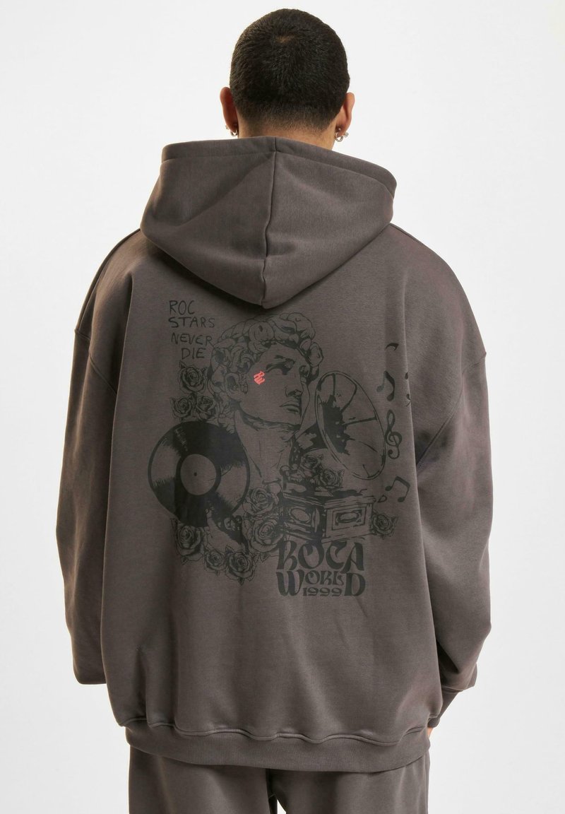 Brown oversized hoodie with a graphic print of a vintage record player and roses on the back. Features a drawstring hood and ribbed cuffs.