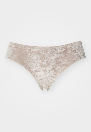 Bas de bikini en velours avec une surface douce et texturée dans une teinte beige clair. Présente un design taille basse et une coupe minimaliste.