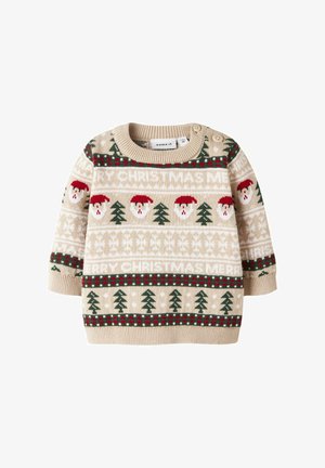 Knit sweater in beige with Christmas patterns, featuring Santa faces and green trees, accented with red and white detailing, and side buttons.