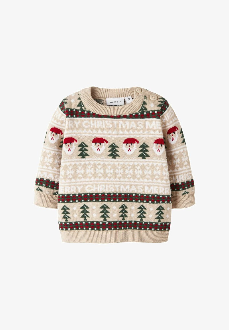 Sweter robiony na drutach w beżowym kolorze z wzorami świątecznymi, przedstawiający twarze Mikołaja i zielone drzewa, podkreślony czerwonym i białym wykończeniem oraz bocznymi guzikami.
