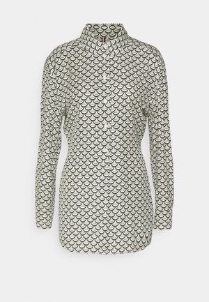 White button-up shirt featuring black fish scale pattern, long sleeves, and a classic collar design.