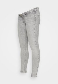 Vaqueros skinny de mezclilla gris con un lavado desgastado, corte ajustado, diseño estándar de cinco bolsillos y sutiles detalles de costura a lo largo de las costuras.