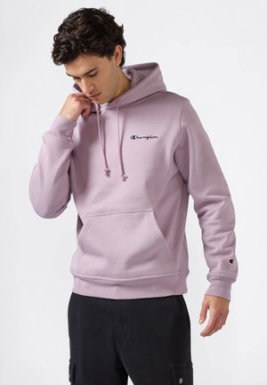 Felpa lilla realizzata in morbido cotone misto, con cappuccio regolabile, tasca anteriore e piccolo logo ricamato sul petto.