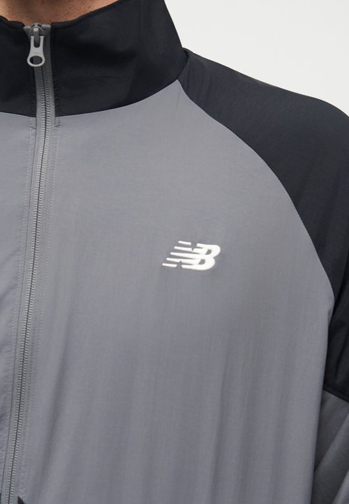 New Balance Chaqueta casual de hombre Sport Legacy Gris — foto 6