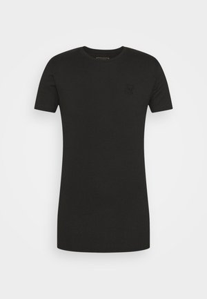 Schwarzes, geripptes T-Shirt mit kurzen Ärmeln, Rundhalsausschnitt und einem dezenten, geprägten Logodetail auf der Brust. Weicher, strukturierter Stoff.