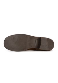 Sole of a brown shoe featuring a textured surface, a flat shape, and a logo imprint, with a smooth heel section and a rectangular indent.
