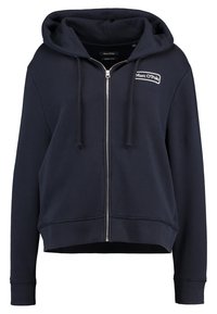 Felpa blu navy con zip, realizzata in cotone, con logo frontale, coulisse, polsini a costine e design corto. Texture morbida e vestibilità casual.