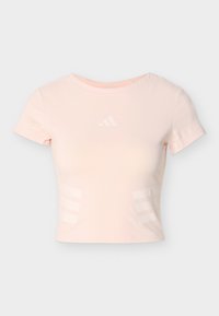 Ανοιχτό ροζ crop top Adidas με κοντά μανίκια και διακριτικές τρεις ρίγες στα πλαϊνά, καθώς και λογότυπο στο κέντρο του στήθους.