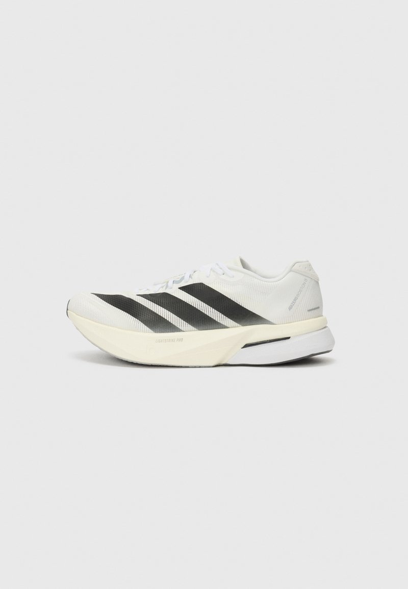 White athletic shoe with black stripes, lightweight mesh upper, rounded toe, and a cushioned sole labeled "Lightstrike Pro."