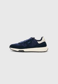 Navy blue sneakers with a mix of smooth and suede textures, featuring a white sole, contrasting laces, and GANT branding on the side.