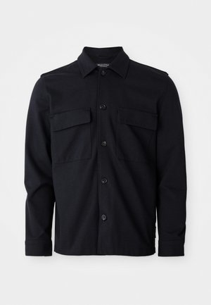 Black long-sleeve shirt jacket with collar, front button closure, and two chest flap pockets against plain white background.