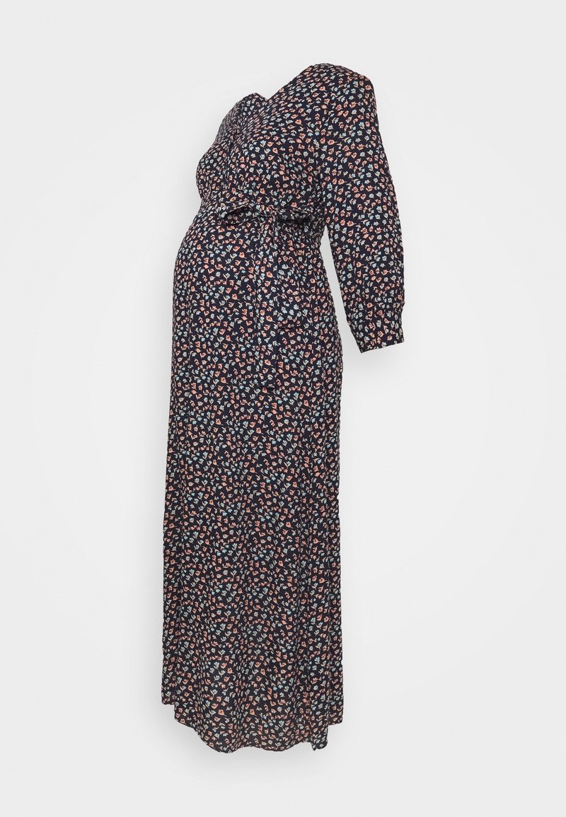 Robe de maternité longue noire avec petit imprimé floral multicolore, manches longues et ceinture à nouer à la taille, présentée sur un mannequin.