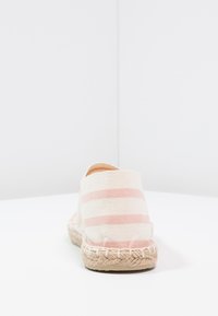 Espadrille shoe with a canvas upper featuring pink and white stripes, jute rope sole, rounded back, and a textured fabric finish.