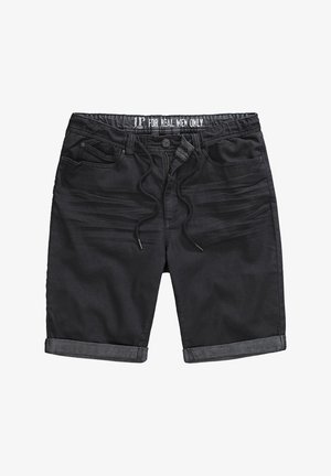 Černé džíny šortky s elastickým páskem na šňůrku, ohrnutými manžetami, přední kapsou a slim-fit designem. Tkanina vypadá hladce s mírnou strukturou.