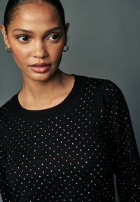 Next Pullover - black sparkle