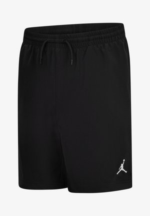 Fekete sportnadrág könnyű anyagból, rugalmas derékrésszel és húzózsinórral. A bal lábszáron fehér Jumpman logó található.