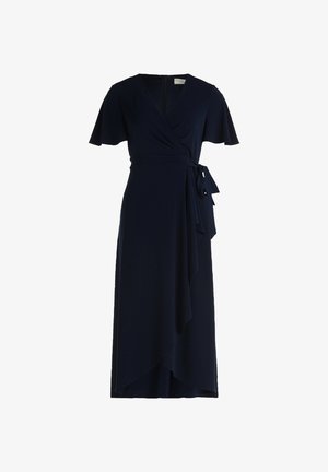 Granatowa sukienka kopertowa z miękkiej tkaniny, z krótkimi falbaniastymi rękawami, wiązanym talią i zwiewną spódnicą o ukośnym dole.